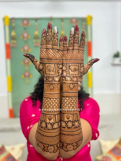 A full view of a bridal design with initials and traditional motifs.