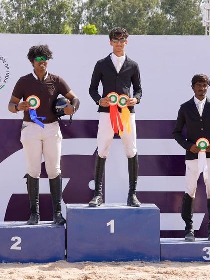 Ajey and Vedette on the podium after securing a commendable 4th place finish at the FEI World Challenge.