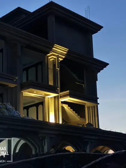 A glimpse into the making of a timeless resort design at dusk. This image shows the structural form taking shape, where light and architectural elements converge to create a harmonious and striking silhouette.