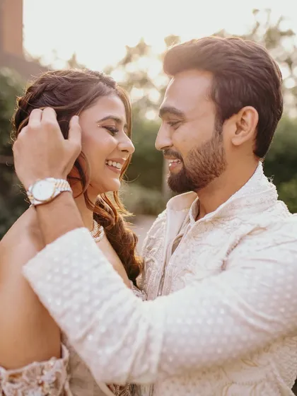 A sweet moment between the couple during their Carnival event. Her makeup is soft and romantic, designed to look beautiful and natural in the golden hour light.