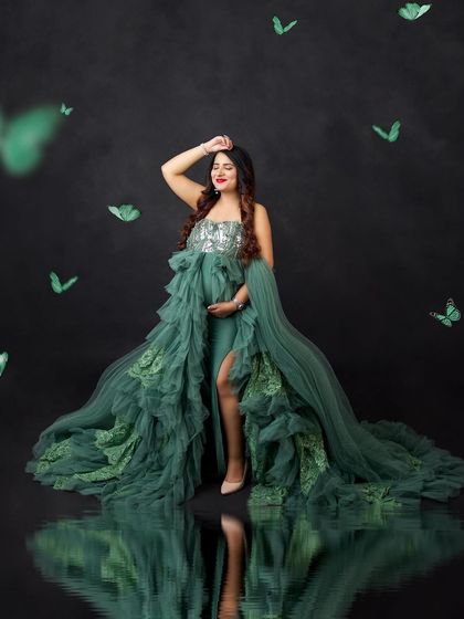 A touch of magic with digital butterflies. This portrait combines a glamorous green gown with a whimsical element for a truly unique and enchanting result.