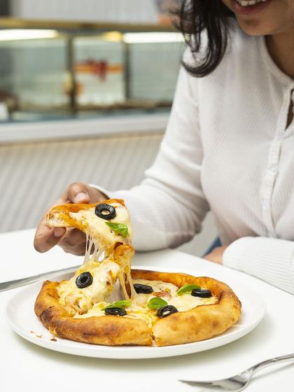 That moment of pure pizza bliss. Grab a slice of our classic margherita and enjoy the simple perfection of tomato, mozzarella, and fresh basil on a sourdough crust.
