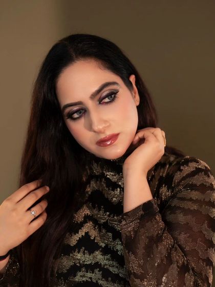 This close-up shot focuses on the model's expressive eyes and glossy lips. The warm lighting creates a gentle and inviting mood, perfect for a beauty or lifestyle portfolio.