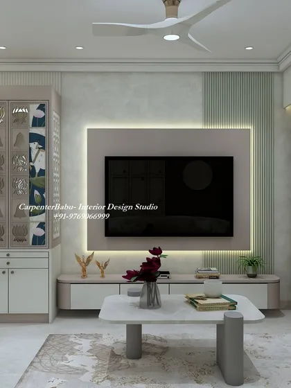A living room at Wadhwa Courtyard, Thane, featuring a TV unit next to a beautifully designed puja unit with jali doors. This shows how I integrate spiritual and living spaces seamlessly.