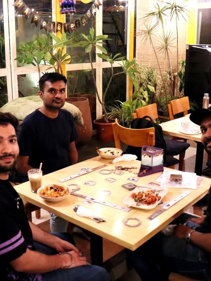 A game of 'Jaipur' over some snacks and cold coffee. It's the perfect way to spend a relaxed afternoon with a friend.