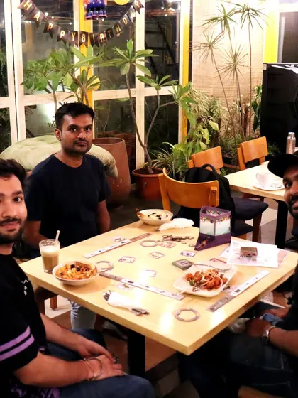A game of 'Jaipur' over some snacks and cold coffee. It's the perfect way to spend a relaxed afternoon with a friend.