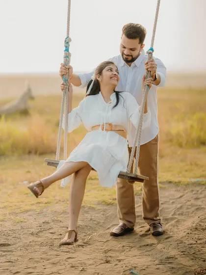 Another joyful moment on the swing set. These action shots add a sense of fun and movement to your pre-wedding photo collection.