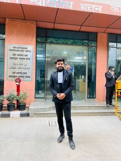 Standing before the New Court Building at the Karkardooma Court Complex. My practice is built on being present and active where it matters most for my clients' civil cases.