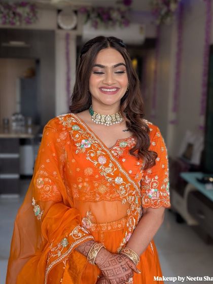 A close-up of this fresh and pretty makeup look. The focus is on clean skin, defined brows, and a happy smile.