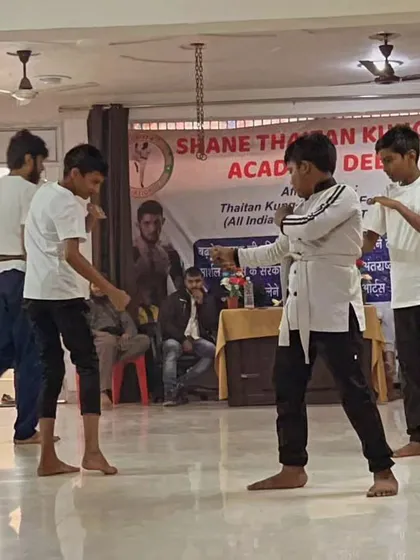 Students practicing blocking and striking drills in a group. Repetition is the mother of skill. We drill these moves until they are perfect.