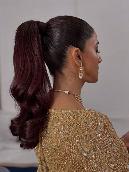 The back view of the powerful and elegant high ponytail.