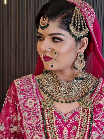 This side profile shows the intricate details of the jhoomar and the matching earrings. We customize these sets for our brides.