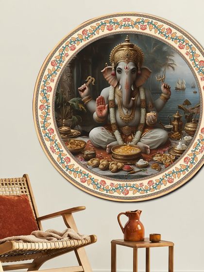 This circular fabric-embossed painting of Lord Ganesh is a symbol of blessings and peace. The intricate design and premium frame make it a beautiful focal point for any room.