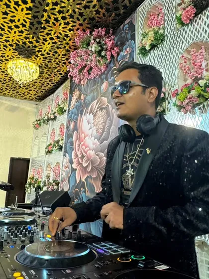 Our DJ spinning tracks at a destination wedding. We provide top-tier DJs who specialize in Bollywood, commercial, and after-party music to keep your celebration going.