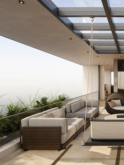 The terrace offers multiple seating zones, including a large sectional sofa and a hanging swing, perfect for everything from large gatherings to quiet moments alone. A glass railing ensures unobstructed views of the surroundings.