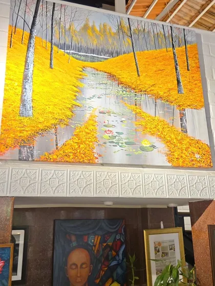 This expansive landscape painting, with its vibrant yellow foliage and serene stream, shows the scale and impact our artworks can have, transforming a room into an immersive experience.