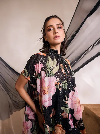 A close-up portrait in the LIANA Kurti Set, highlighting the high-neck embellishment and the vibrant floral print.