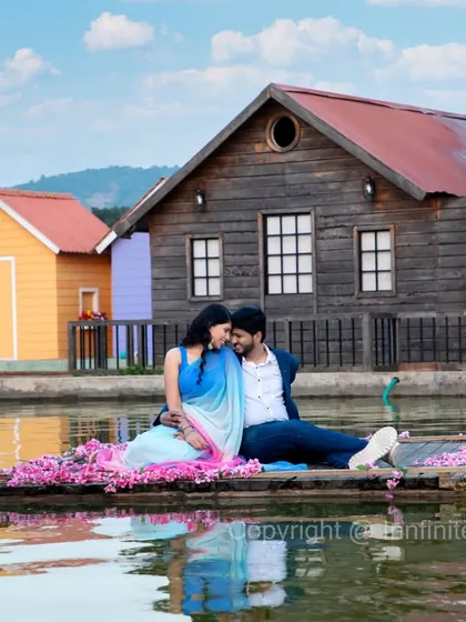 A romantic scene on a floating raft, with colorful boathouses in the background providing a charming and rustic backdrop.