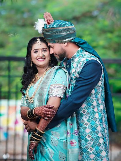 A joyful portrait of the couple embracing. The bride's bright smile and the groom's loving hold make this a heartwarming and genuine moment captured on camera.