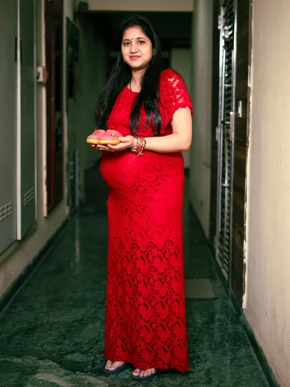 A full length shot showing how we can use your own home for a maternity session. The hallway creates a unique perspective for this beautiful portrait.