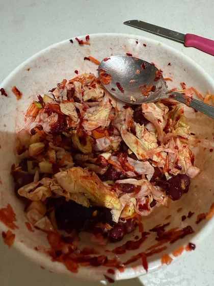 A vibrant salad with shredded cabbage, beetroot, and other vegetables. This is part of a home-based meal plan for a client with diabetes.
