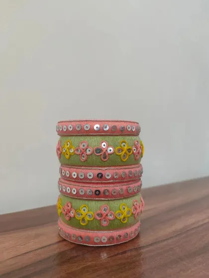 A closer look at my pastel green and pink bangles. These are intricately decorated with thread embroidery and sequin work, and can be made in any color combination you desire.