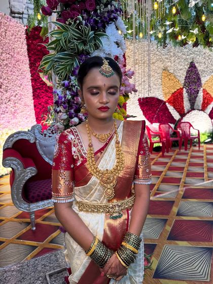 Another angle of Priyanka's bridal look, showcasing the balance between a bold lip and defined eyes, ensuring the bride looks beautiful from every perspective.