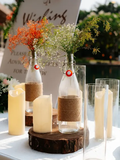 The same rustic centerpiece, showing how simple elements can create a beautiful and charming vignette. This setup is perfect for a wishing table or a guest book station.