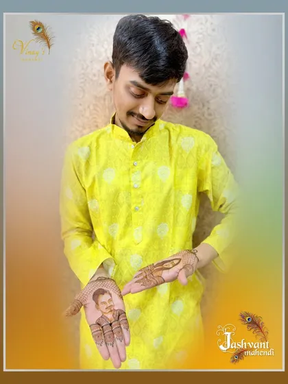 The groom admiring the detailed portrait of his partner on his hand.