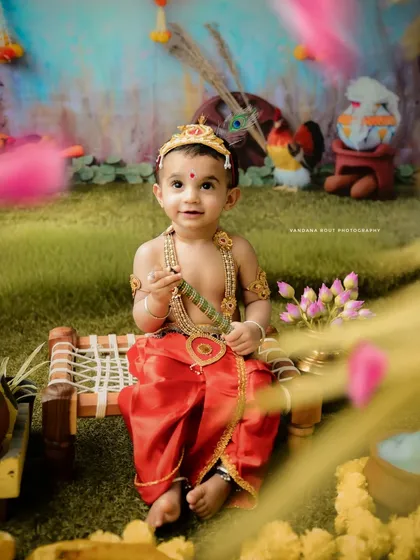Themed photoshoots are so much fun, and this 'Little Krishna' session is a favorite among parents. I provide the complete costume and set up a vibrant, detailed backdrop to bring the story of Janmashtami to life for your child.