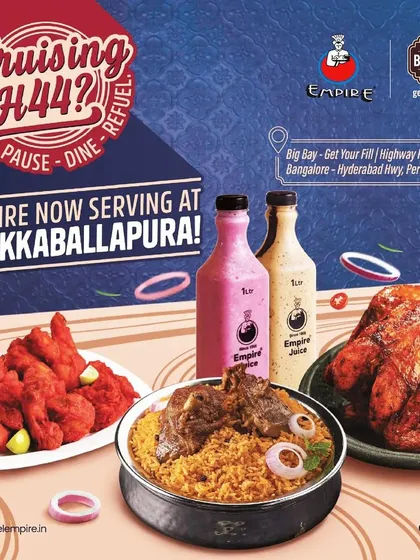 An advertisement for Empire restaurant, showcasing their delicious offerings like biryani and grilled chicken, now serving at Big Bay.