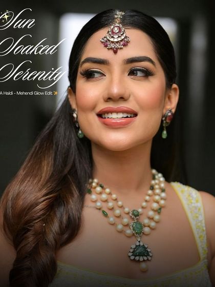 Sun-soaked serenity. This image captures the essence of a Haldi-Mehendi glow, with dewy, peachy makeup that matches the marigold dreams of the event.