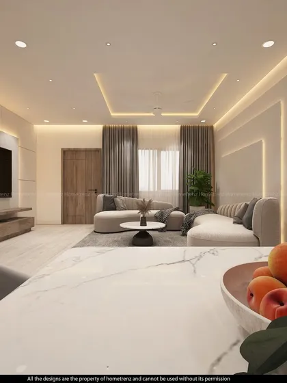 A view from the dining island into the living area. The design uses a consistent color palette of whites, greys, and woods to create a unified and sophisticated open-plan space.