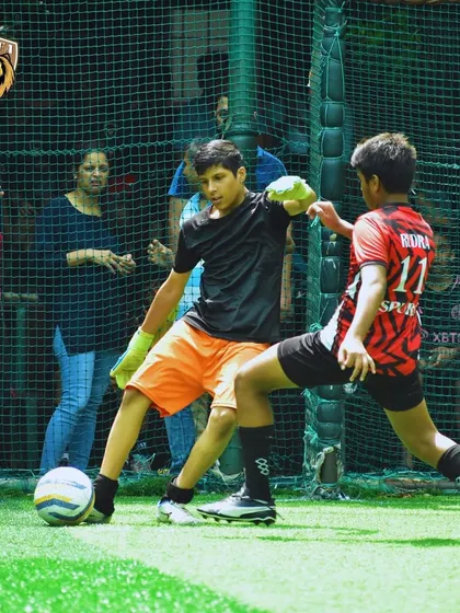 Our goalkeeper making a brave save in a one on one situation during the tournament.