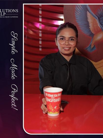 Another of our talented female mixologists, ready to serve perfect cocktails in impeccable attire.