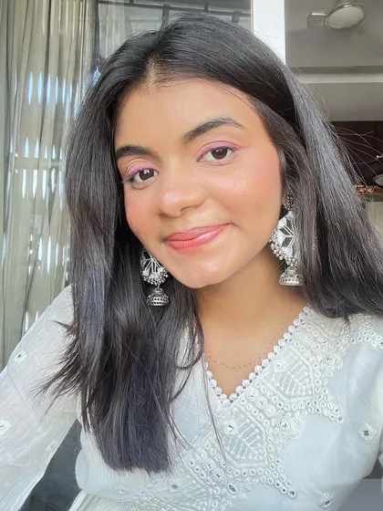 Another angle of the playful pink eyeliner. It's a simple way to add a creative touch to an otherwise minimal makeup look.