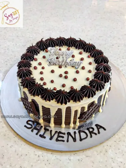 This chocolate mousse cake is pure therapy. The contrast between the white drip and the dark chocolate decoration makes it as beautiful as it is delicious.