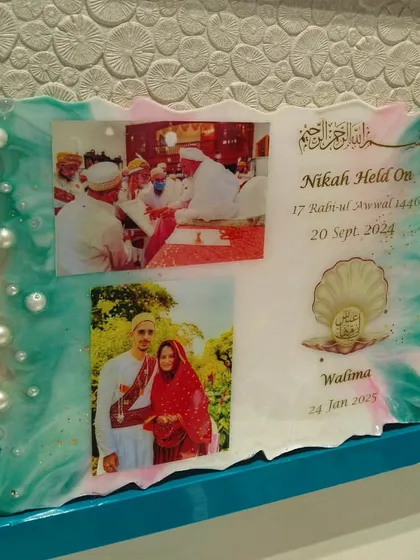 This is a resin wedding invitation I created. It's a unique way to announce your special day and give your guests a beautiful memento that won't get thrown away, featuring your photos, dates, and decorated with pearls and custom colors.