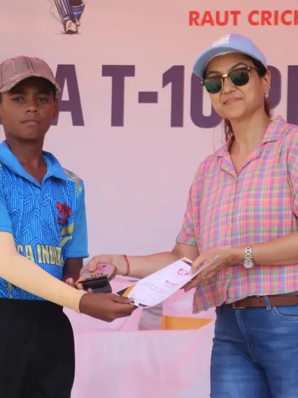 Another champion from the RCA Indians team with his award.