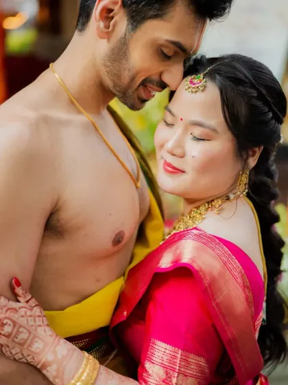 An intimate embrace during their temple wedding. Anirudh and Lisa's portraits are filled with warmth and genuine affection.