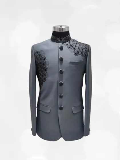 For a bold and contemporary look, consider this grey Jodhpuri suit. The asymmetric black peacock feather embroidery on the shoulder makes it a unique and artistic piece.