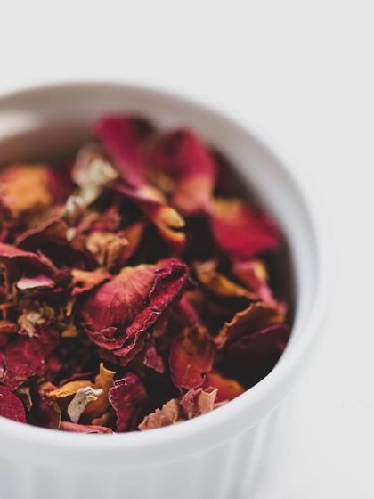The delicate texture of dried rose petals, a key to adding fragrance and a touch of royalty to Mughlai dishes.