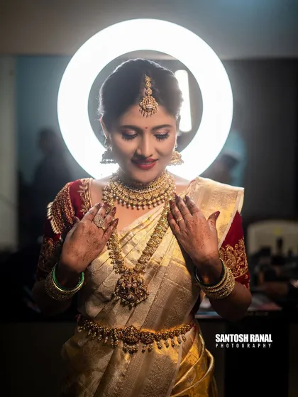 A stunning bridal portrait using a ring light to create a beautiful halo effect and highlight the bride's features. We focus on capturing the elegance and joy of the bride on her special day.