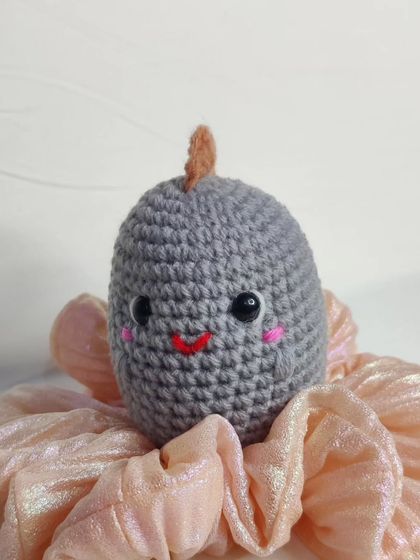 My tiny dino keychains are a handful of cuteness. They come in four different colors: blue, yellow, green, and grey.