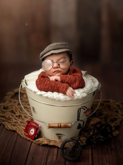 A wider view of the vintage setup, showing the miniature props like a radio and bicycle that help build the scene.