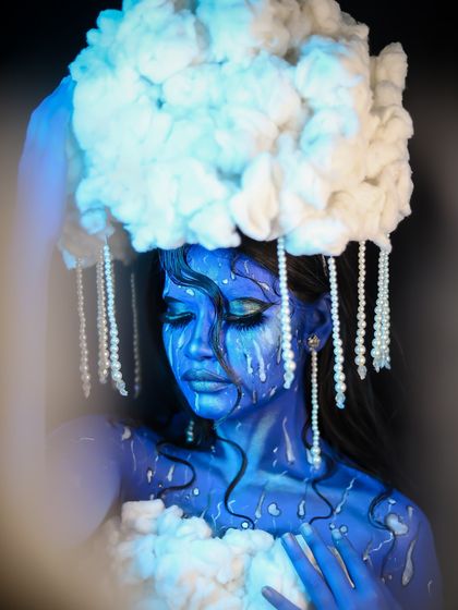 Another angle of the cloud look, showing the texture of the headpiece and the smoky background.