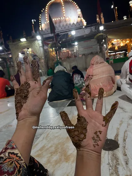Another shot from Ajmer Sharif, showing two hands with simple, beautiful mehendi.