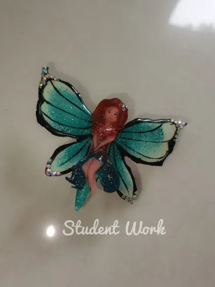 This whimsical 3D fairy with glittery wings is another amazing piece of student work. You will learn to bring imaginative characters to life on a miniature scale.