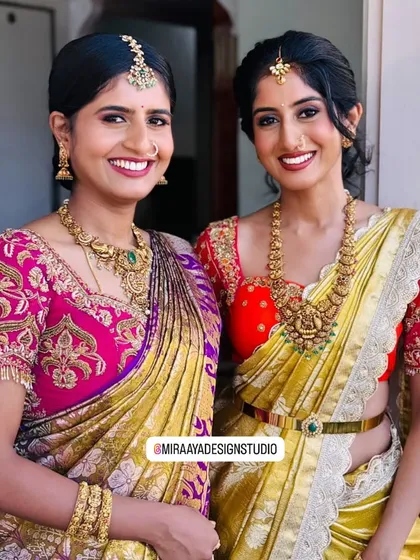 I love creating coordinated looks for family and friends. Here, two clients are ready for a wedding celebration in their custom blouses, one with vibrant pink zardosi work and the other in a bright yellow and red combination, both designed to complement their beautiful silk sarees.