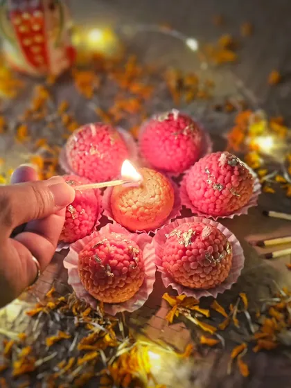 Lighting up one of my iconic Motichoor Ladoo candles. This is the star of my festival ensemble, perfect for illuminating your celebrations and gifting a unique, sweet-smelling treat to loved ones.